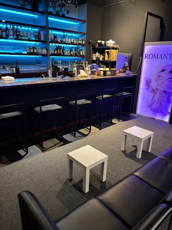 The dimly lit bar counter inside EVE in Osaka
